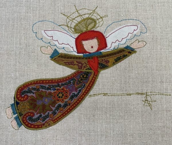 Angel: paisley robe on natural linen