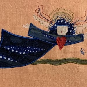 Angel: deep blue robe on peach linen