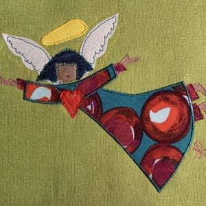 Angel: red bauble robe on pea green linen