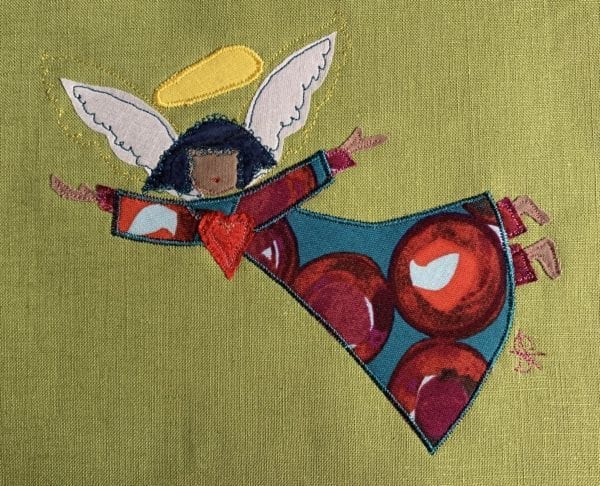 Angel: red bauble robe on pea green linen