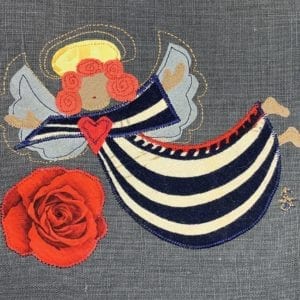 Angel: navy & white stripe robe on slate linen with big rose